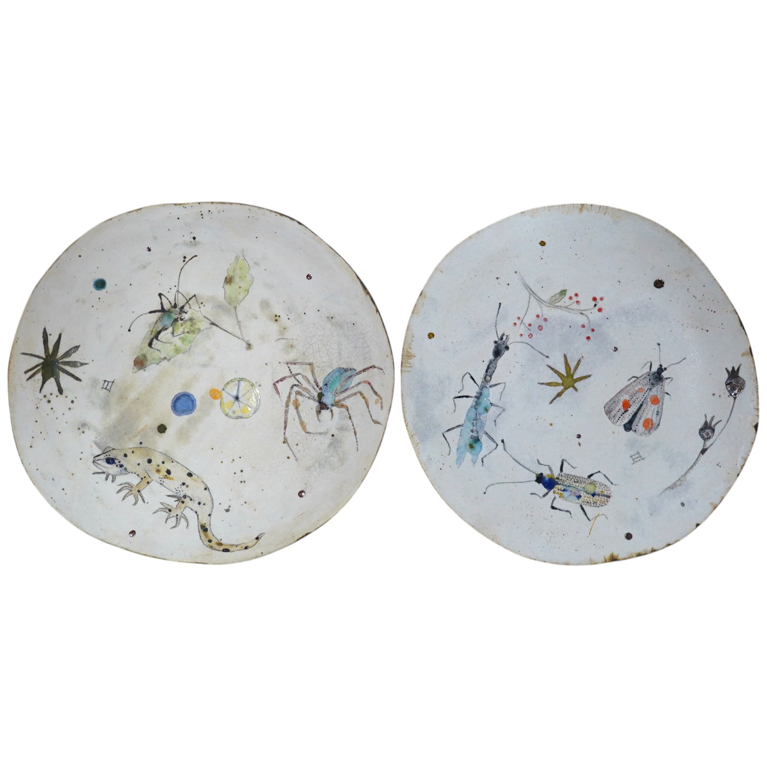 A pair of Eva Hernandez pottery plates, 26cm. Condition - good